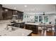 Bright, modern kitchen featuring granite countertops and stainless steel appliances, seamlessly flowing into the living area at 1735 Jobeth Se Ave, Atlanta, GA 30316