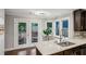 Kitchen with granite countertops, stainless sink, and a view to the backyard deck through glass patio doors at 1735 Jobeth Se Ave, Atlanta, GA 30316