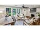 Inviting living room featuring a decorative fireplace, ample natural light, and a comfortable seating area at 1735 Jobeth Se Ave, Atlanta, GA 30316