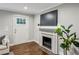 Living room featuring a fireplace, wood floors, and a view of the entry door at 1735 Jobeth Se Ave, Atlanta, GA 30316
