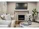 Cozy living room with a fireplace, sofa, area rug, and view of the front door at 1735 Jobeth Se Ave, Atlanta, GA 30316