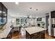 Open concept living space with a dining area, cozy fireplace and large windows to let the light in at 1735 Jobeth Se Ave, Atlanta, GA 30316