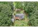 Aerial view of home with deck surrounded by trees at 1904 Britt Dr, Snellville, GA 30078