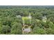Overhead view displays house surrounded by trees and neighborhood at 1904 Britt Dr, Snellville, GA 30078