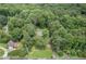 Aerial view of the home in a secluded, heavily wooded location at 1904 Britt Dr, Snellville, GA 30078