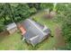Aerial view of home and deck surrounded by trees at 1904 Britt Dr, Snellville, GA 30078