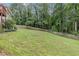 Backyard featuring wooded views and fence at 1904 Britt Dr, Snellville, GA 30078