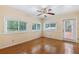 Sun-filled bedroom featuring hardwood floors, neutral walls, and a ceiling fan at 1904 Britt Dr, Snellville, GA 30078