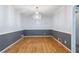Empty dining room featuring hardwood floors, chair rail, and a chandelier at 1904 Britt Dr, Snellville, GA 30078