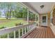 Covered front porch with decorative flower planters and a view of the lawn at 1904 Britt Dr, Snellville, GA 30078