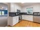 Modern kitchen with stainless appliances, granite countertops, and hardwood floors at 1904 Britt Dr, Snellville, GA 30078