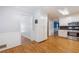 Open eat-in kitchen space with hardwood floors, and white cabinetry at 1904 Britt Dr, Snellville, GA 30078