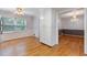 Bright eat-in kitchen space with hardwood floors and white cabinetry at 1904 Britt Dr, Snellville, GA 30078