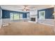 Spacious living room featuring a fireplace, bay window, and ample natural light at 1904 Britt Dr, Snellville, GA 30078