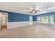 Large living room with a bay window, ample sunlight, and neutral carpeting at 1904 Britt Dr, Snellville, GA 30078