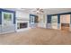 Inviting living room with a cozy fireplace, built-in shelving, and neutral carpeting at 1904 Britt Dr, Snellville, GA 30078