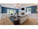 Bright, styled living room with fireplace, seating, and large windows at 1904 Britt Dr, Snellville, GA 30078