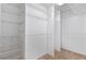 Spacious walk-in closet with ample shelving and hanging space for organized storage at 1904 Britt Dr, Snellville, GA 30078