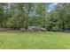 Single-story home on a spacious lot bordered with mature trees at 1904 Britt Dr, Snellville, GA 30078