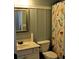 Bathroom featuring a toilet, vanity, mirror and mermaid shower curtain at 1951 Barrett Knoll Nw Cir, Kennesaw, GA 30152