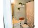 Cozy bathroom features neutral tones, modern sink and vanity, decorative shelving with plants, and patterned shower curtain at 1951 Barrett Knoll Nw Cir, Kennesaw, GA 30152