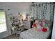 Charming bedroom featuring a desk, soft toys, and leafy wall decor at 1951 Barrett Knoll Nw Cir, Kennesaw, GA 30152