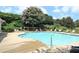 A refreshing community pool surrounded by lounge chairs and lush greenery for relaxation at 1951 Barrett Knoll Nw Cir, Kennesaw, GA 30152