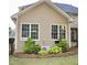 Exterior view of home featuring neutral siding, manicured landscaping, and double-paned windows at 1951 Barrett Knoll Nw Cir, Kennesaw, GA 30152