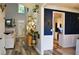 Bright foyer featuring hardwood floors, fireplace, and access to the kitchen at 1951 Barrett Knoll Nw Cir, Kennesaw, GA 30152