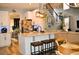 Open-concept kitchen with island, stainless steel appliances, and seating overlooking living area at 1951 Barrett Knoll Nw Cir, Kennesaw, GA 30152