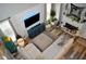Bright living room with a textured wall, fireplace, and a comfortable sectional sofa at 1951 Barrett Knoll Nw Cir, Kennesaw, GA 30152