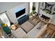 Aerial view of a stylish living room with fireplace, unique wall decor and modern furniture at 1951 Barrett Knoll Nw Cir, Kennesaw, GA 30152