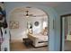 View of the bright main bedroom, featuring a cozy seating area and ensuite bathroom entrance at 1951 Barrett Knoll Nw Cir, Kennesaw, GA 30152