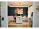 Office with blue accent wall features modern lighting, large decorative artwork, and a double desk setup at 1951 Barrett Knoll Nw Cir, Kennesaw, GA 30152
