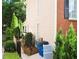 Side yard with an air conditioning unit, manicured landscaping, and sidewalk at 1951 Barrett Knoll Nw Cir, Kennesaw, GA 30152