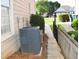 Narrow side yard with walkway and greenery providing access between the front and back at 1951 Barrett Knoll Nw Cir, Kennesaw, GA 30152