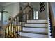 Elegant staircase with dark iron railings and wood trim, leading to the upper level at 1951 Barrett Knoll Nw Cir, Kennesaw, GA 30152