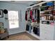 Walk-in closet with an organized shelving system and a window at 1951 Barrett Knoll Nw Cir, Kennesaw, GA 30152