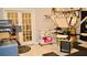 A versatile work room with french doors, equipment, storage, and an epoxy floor with decorative inlay tiles at 1951 Barrett Knoll Nw Cir, Kennesaw, GA 30152