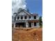 Under construction two-story home with ladder and visible framework showcasing building progress at 324 Bloomfield Cir, Canton, GA 30114