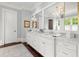Elegant bathroom featuring a marble countertop, double sinks, and modern fixtures at 6440 Westchester Pl, Cumming, GA 30040