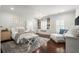 Charming bedroom with built-in bookshelves, a cozy bench, and natural light at 6440 Westchester Pl, Cumming, GA 30040