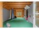 Spacious bonus room with exposed wood beams, a window, and ample space for various activities or hobbies at 6440 Westchester Pl, Cumming, GA 30040