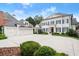 Stunning two-story home with blue shutters, three-car garage, and a spacious driveway at 6440 Westchester Pl, Cumming, GA 30040