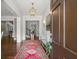 Inviting foyer showcasing hardwood floors, decorative rug, chandelier, and stylish decor creating a warm welcome at 6440 Westchester Pl, Cumming, GA 30040