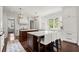 Spacious kitchen with dual islands, marble countertops, stainless appliances, and natural light at 6440 Westchester Pl, Cumming, GA 30040