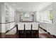 Bright kitchen featuring double islands, modern fixtures, and custom cabinetry at 6440 Westchester Pl, Cumming, GA 30040