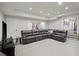 Spacious rec room features a large sectional sofa and a flat-screen TV at 6440 Westchester Pl, Cumming, GA 30040