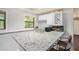 Basement bar area featuring a granite countertop and seating at 8605 Stone Creek Ct, Douglasville, GA 30135