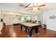 Spacious finished basement with a pool table, bar and ample entertaining space at 8605 Stone Creek Ct, Douglasville, GA 30135